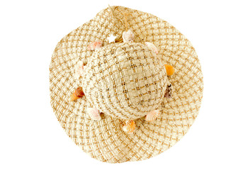 Top View of a home decorated woman straw hat with seashells on white background.