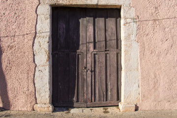 Fototapeta na wymiar Old rustic colonial door and wall