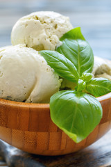 Delicious basil ice-cream in a wooden bowl.