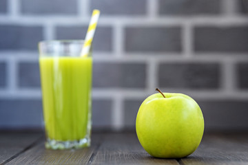 Fresh juice. Green apple. Copy space. The concept is healthy food, vegan, diet, weight loss.