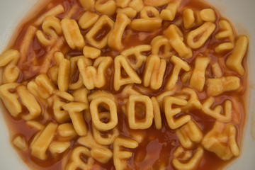 Bowl of alphabet spaghetti with the message "I want to die"