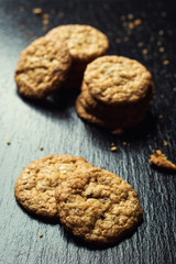 Biscuit sweet cookie background. Domestic stacked butter biscuit pattern concept,close up macro.Homemade cookies on wooden table.Cereal biscuits with the sesame,peanuts,sunflower and amaranth.