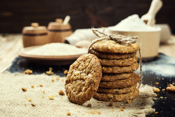 Biscuit sweet cookie background. Domestic stacked butter biscuit pattern concept,close up macro.Homemade cookies on wooden table.Cereal biscuits with the sesame,peanuts,sunflower and amaranth.