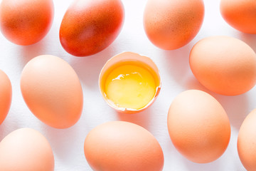 Chicken eggs and yolk on a white background