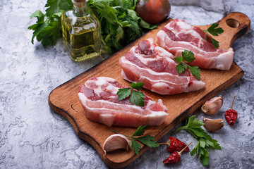 Raw pork meat and ingredients for cooking