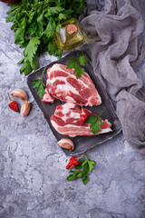 Raw pork meat and ingredients for cooking