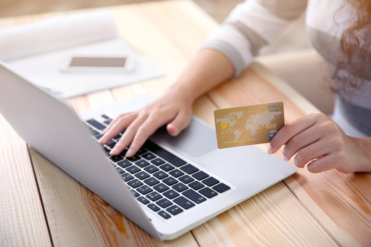 Woman hands using credit card and laptop for online shopping