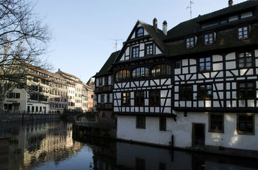 Fototapeta na wymiar Fachwerk medieval cityscape in Strasbourg, timber-framed buildings. Petite France, Ile.