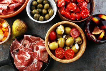 spanish tapas and sangria on wooden table - mediterran antipasti set