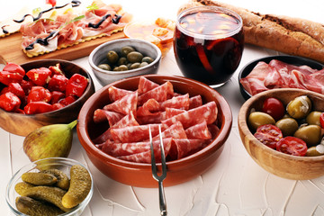 spanish tapas and sangria on wooden table - mediterran antipasti set