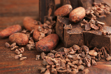 Composition of cocoa products on wooden table