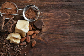 Composition of cocoa products on wooden table