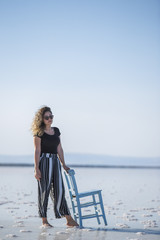 Lovely young woman sitting on chair salt lake
