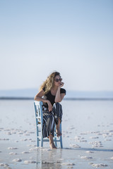 Lovely young woman sitting on chair salt lake