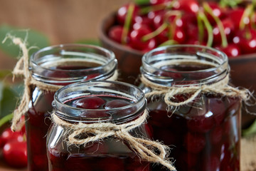 Cherry jam on wooden ground