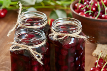 Cherry jam on wooden ground