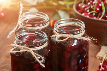 Cherry jam on wooden ground