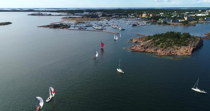 Regatta, Cinema 4k aerial view following the racing sailboats, at the yacht competition, on Hango regatta day, in Uusimaa, Finland