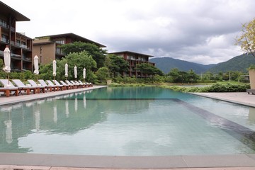 Swimming pool modern design and mountain view for sporting and relax at the Hotel Thailand