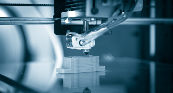 Electronic three dimensional plastic printer during work , 3D , printing.