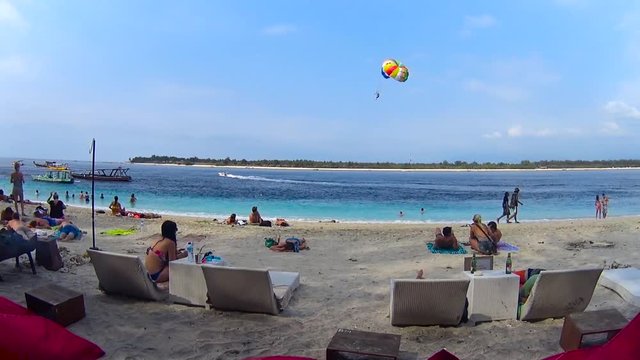 Parasail in front of shoreline, tropical island