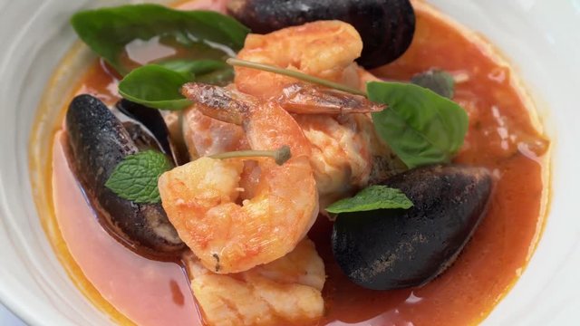 delicious soup with shrimp and seafood to spin in a circle