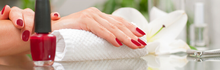 Manicure concept. Beautiful woman's hands with perfect manicure at  beauty salon. - obrazy, fototapety, plakaty