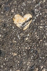 Cracked stone heart, broken heart, road