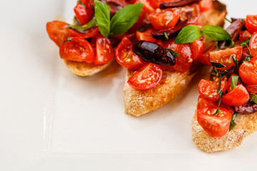 Italian bruschetta with chopped tomatoes, basil and olive