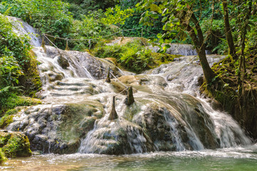 At Mele Cascades Waterfalls a slippery path with guide ropes climbs the hillside through a series of beautiful pools - Port Vila, Efate Island, Vanuatu