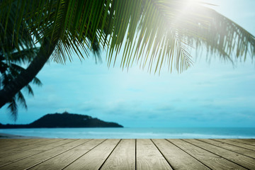 Beach background with palm tree and empty wooden.