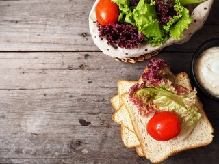 Bread with salad dressing and vegetable