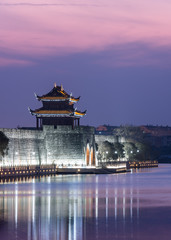 Illuminated City At Waterfront in city of China.