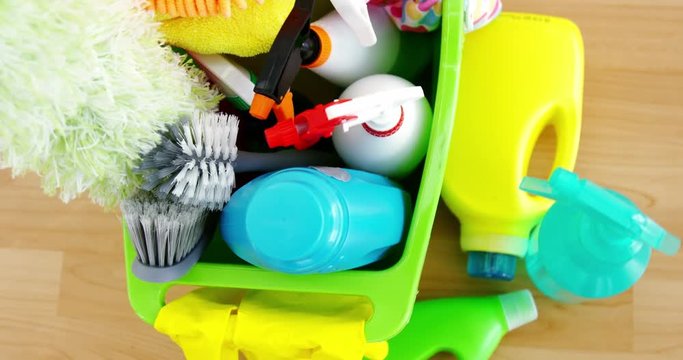Various housekeeping supplies in a bucket