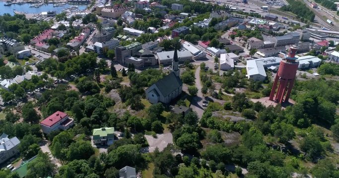 Hanko church, Cinema 4k aerial orbit view around the church, on Hango regatta day, in Finland