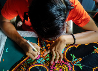 In Making Wau Bulan (Kite)