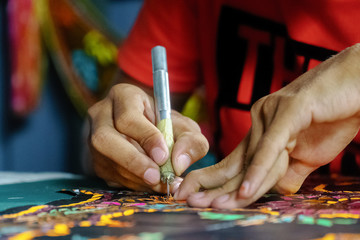 In Making Wau Bulan (Kite)