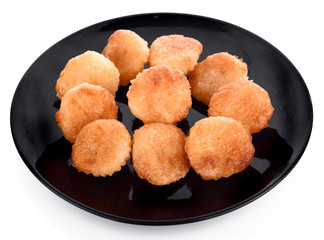 Daredevil coconut candy, candy coconut babin on black dish isolate white back ground