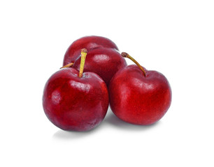 plums isolated on white