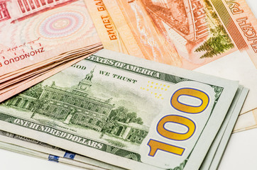 different currency banknotes. dollars, yuan and rubles on white