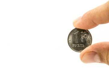 a coin in a hand. russian rubles money coin between fingers