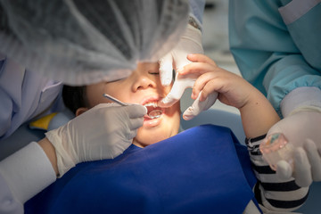 A boy teeth whitening and fluoride treatment