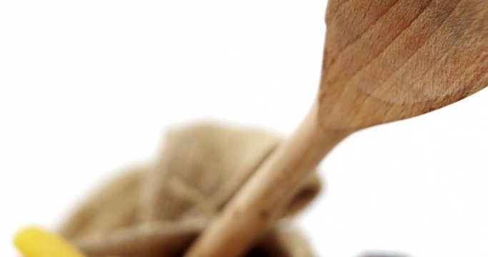 Close-up of raw pasta with wooden spoon