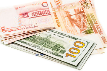 different currency banknotes. dollars, yuan and rubles on white