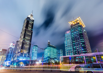 Fototapeta na wymiar urban traffic with cityscape at night in city of China.