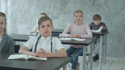 Kids applauding teacher in class