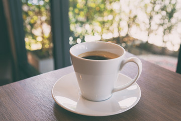  Cup of coffee on a wooden table
