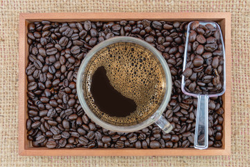 Coffee cup and coffee beans in box