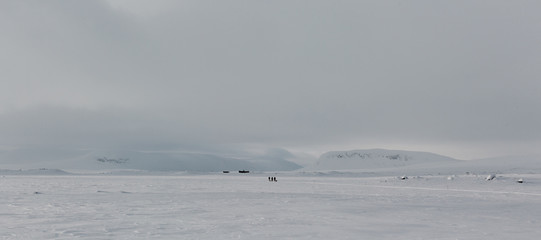 Backcountry hike through frozen lonely country in winter