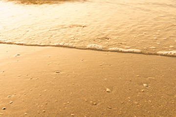 Wave of the sea on the sand beach
